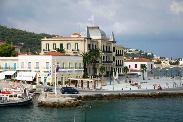 Spetses Island - Cafes and shops next to the stately Poseidonion Grand Hotel